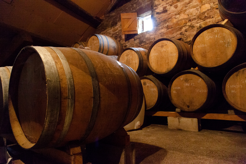 Vin jaune ageing. In one of the pictures one can see the veil, in the other one  a small window for ventilation